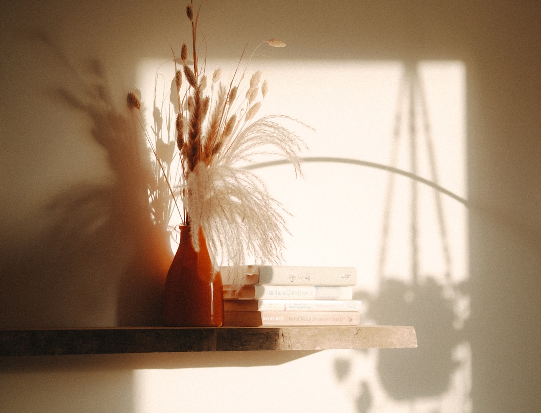 a couple of vases sitting on top of a shelf