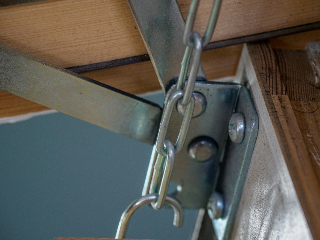 grey metal chain on brown wooden table